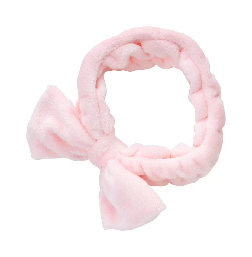 Pretty pink makeup headband with stylish bow and elasticated design.