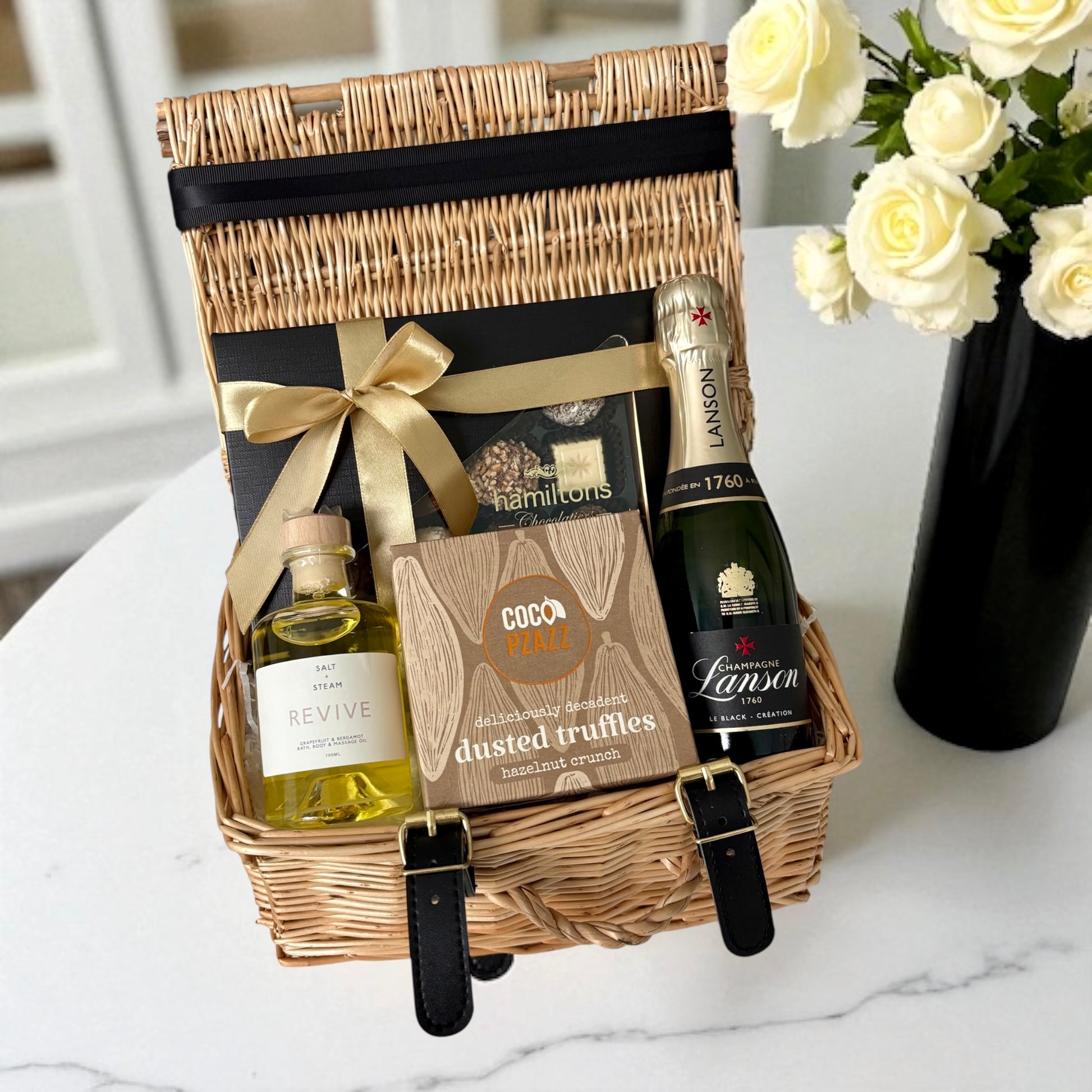 Champagne, chocolates, truffles & bath oil - a little box of luxury for life’s special moments.
