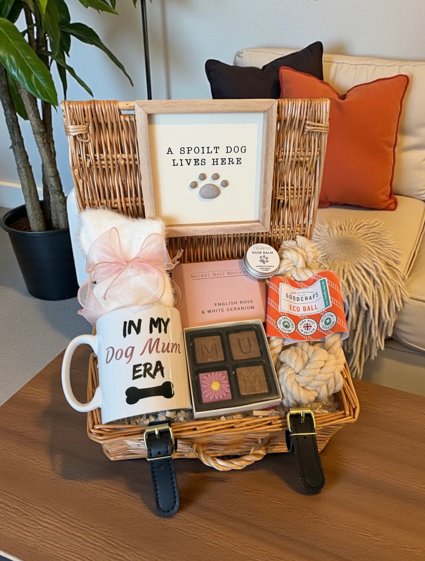 Gift basket with dog mum mug, MUM chocolates, bath salts, socks, dog toy, dog sign and nose balm.