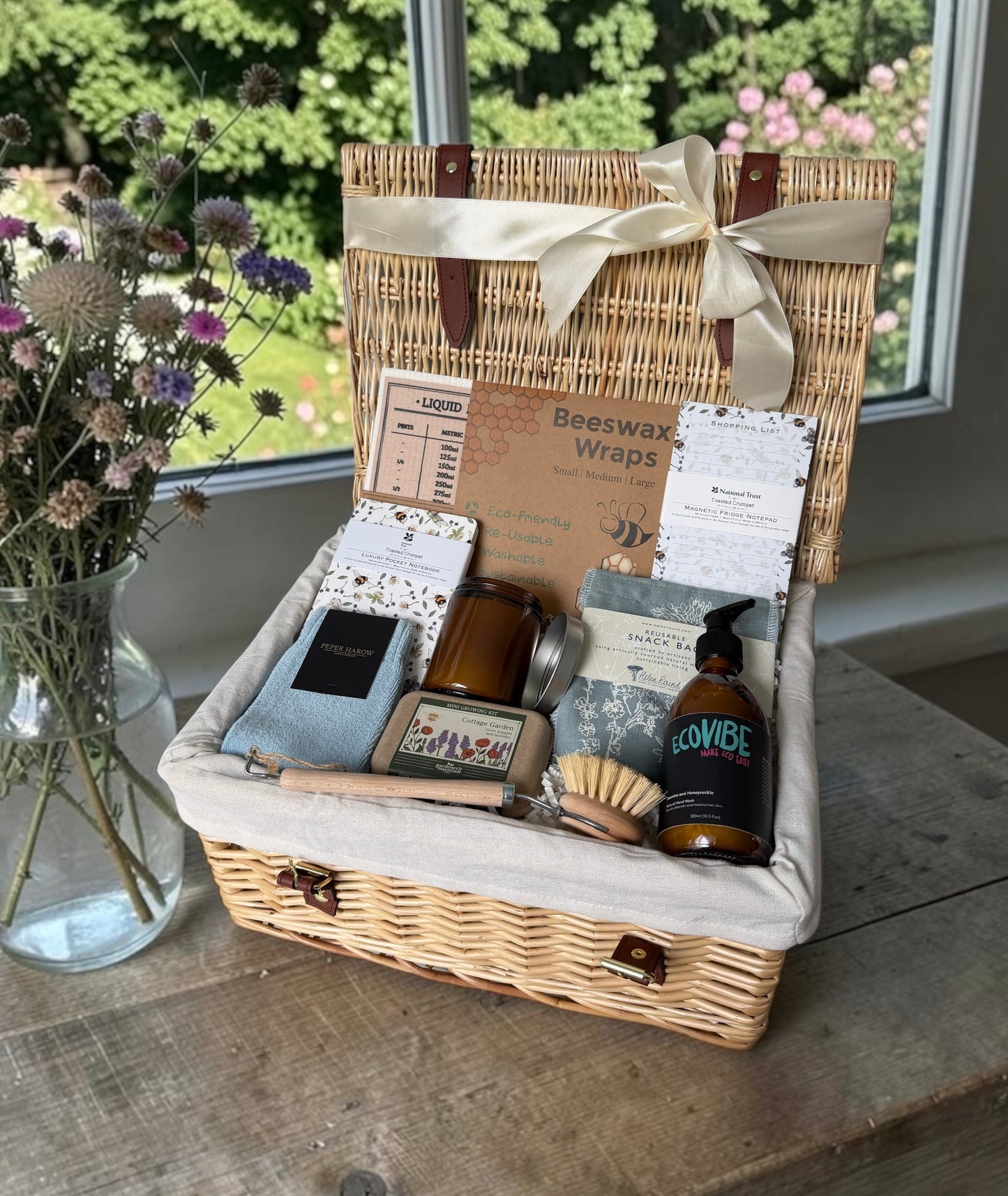 Eco-friendly gift hamper with dish brush, hand soap and reusable kitchen items