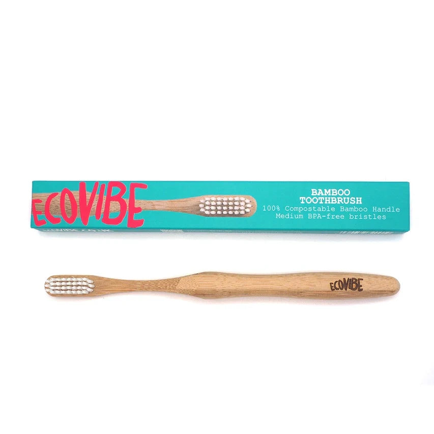 Eco-friendly natural bamboo toothbrush with medium bristles and recyclable packaging.