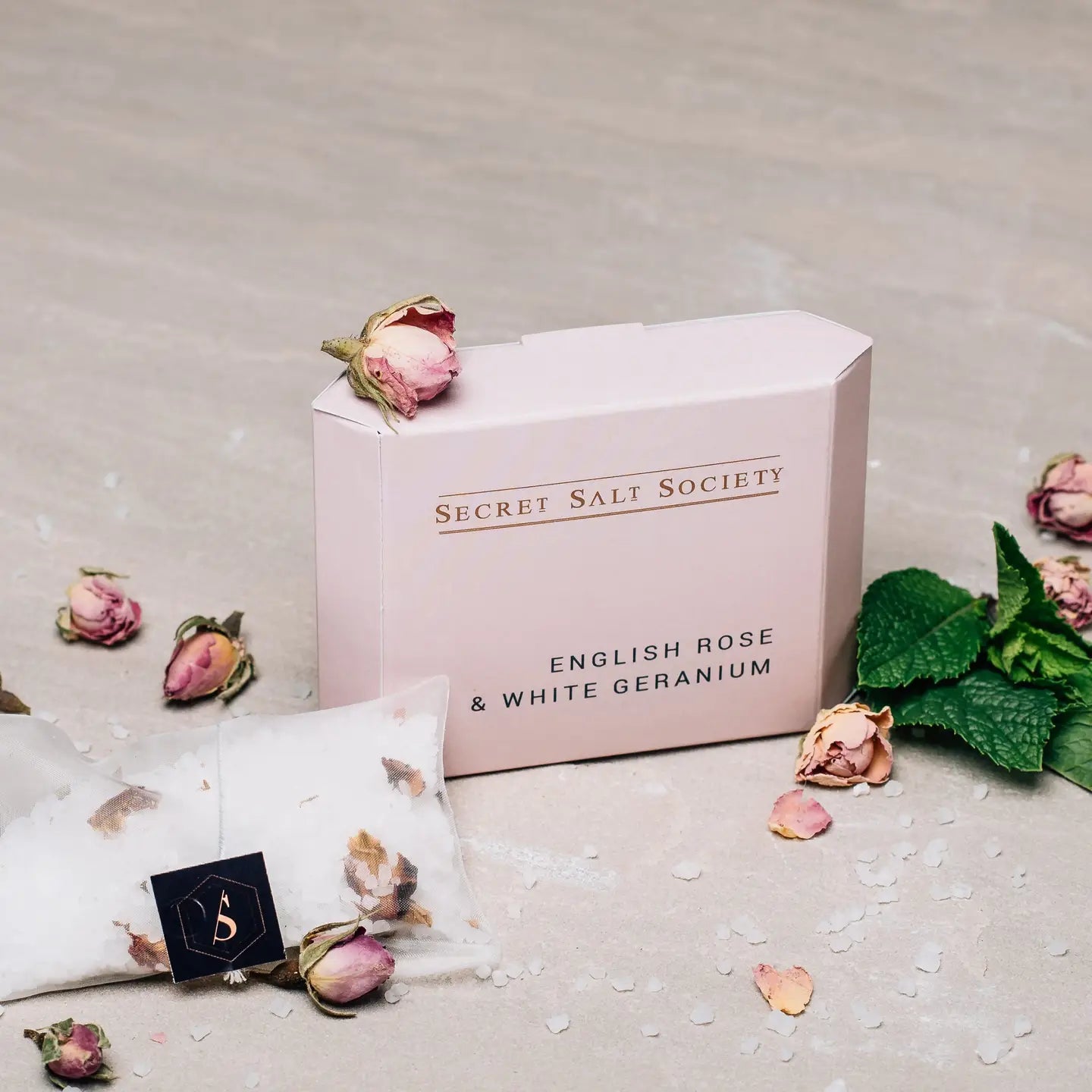 English Rose and White Geranium mineral bath infusion with rose petals and Dead Sea salts.