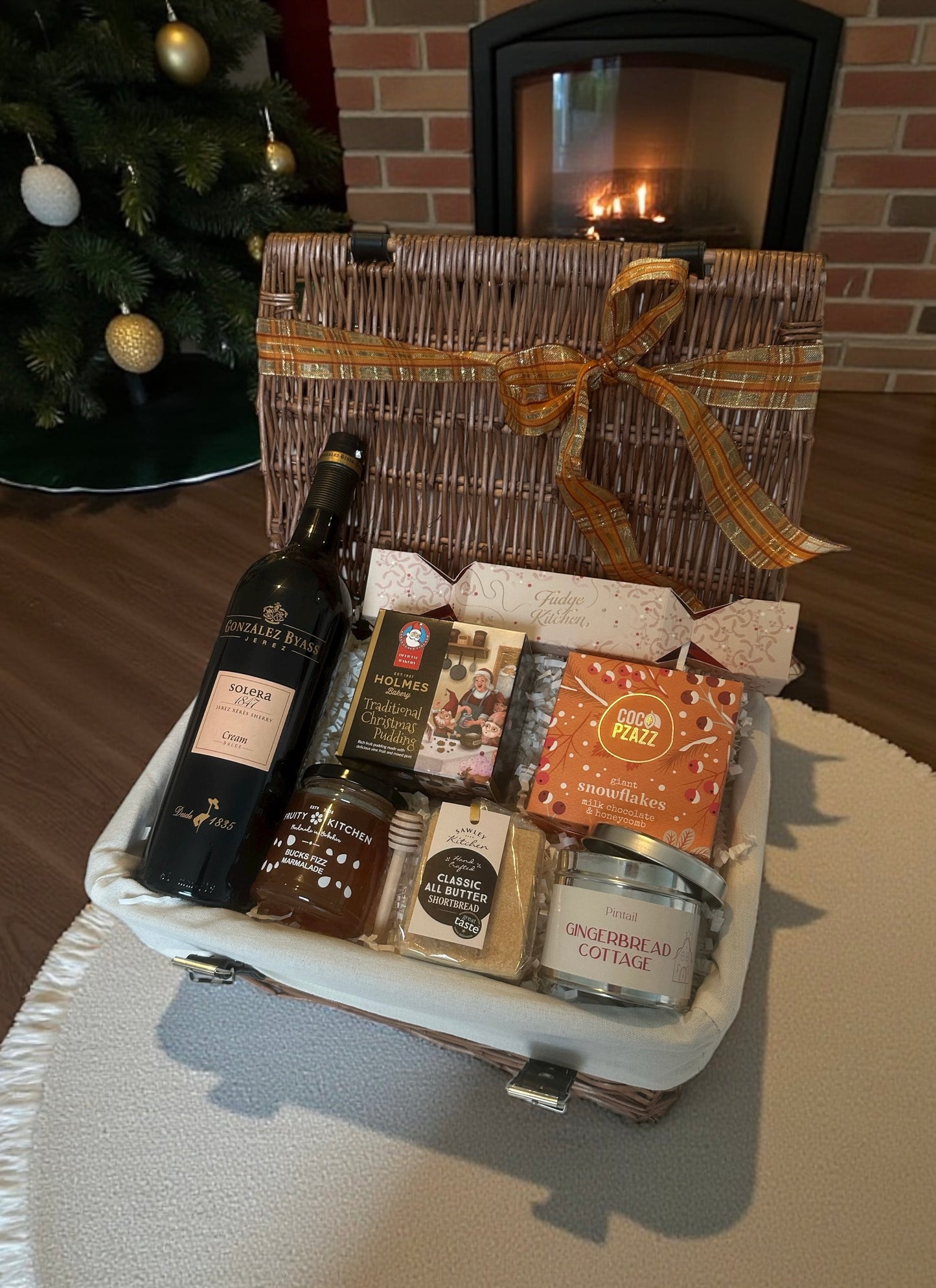 Everything Christmas Hamper with choice of Cream Sherry or Baileys, Christmas pudding, fudge, snowflakes, gingerbread candle, shortbread & Bucks Fizz marmalade.