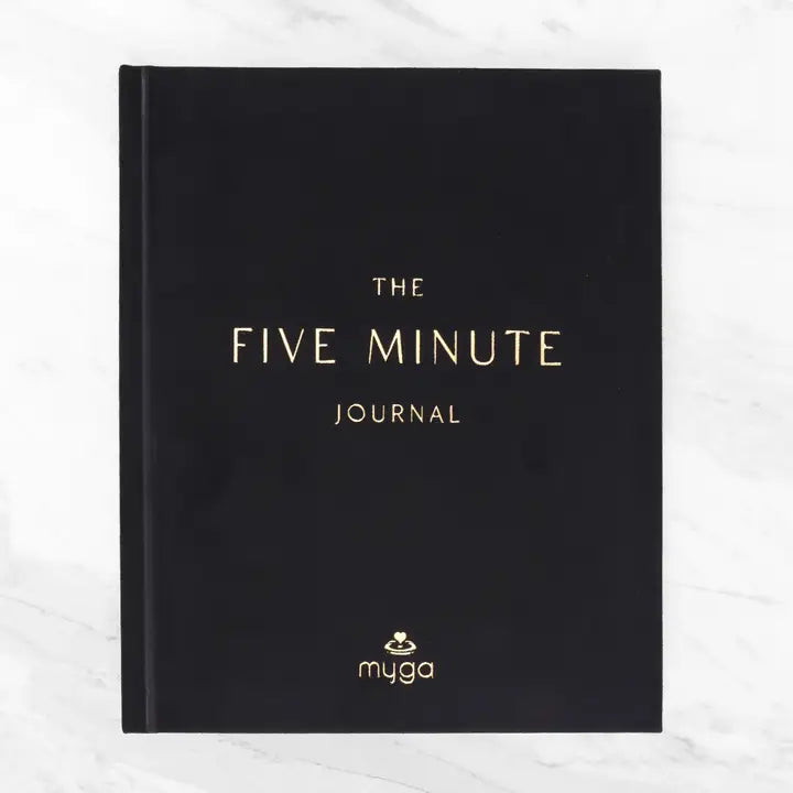 Five Minute Journal in black cover for daily reflection and gratitude.