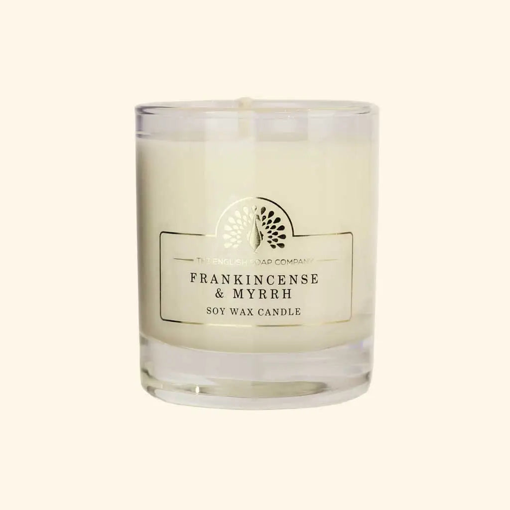 Enchanting Frankincense and Myrrh Soy Wax Candle with woody aroma in a glass jar.