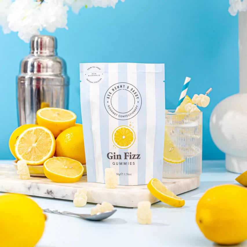 Lemon Gin Fizz gummy sweets pouch with fresh lemons and cocktail shaker.