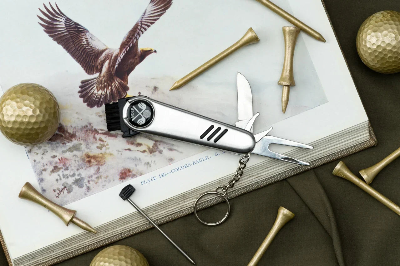 Compact multipurpose golf tool with knife and divot repair features, ideal for golf lovers.