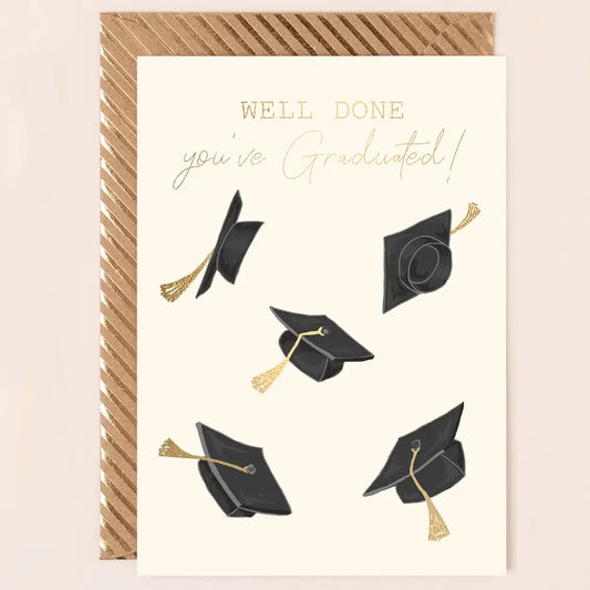 Graduation card with gold foil writing and cap pattern, includes patterned envelope.