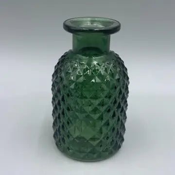 Green patterned glass vase with intricate design, 9.2cm tall.