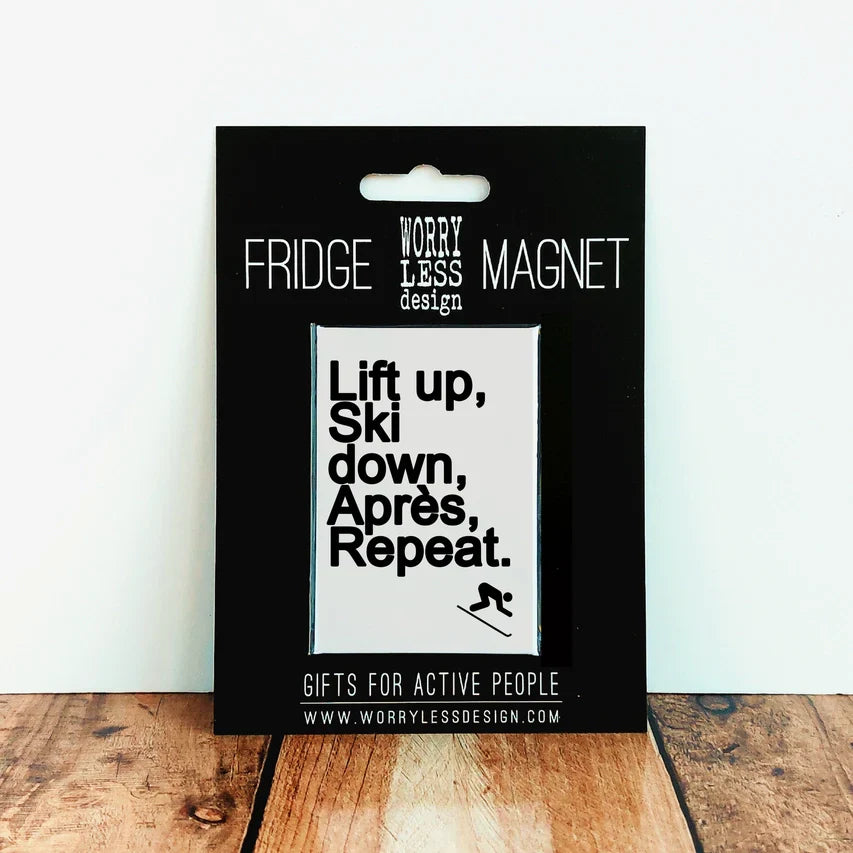 Amusing Ski Lovers Fridge Magnet with "Lift up, ski down" slogan on black backing card.