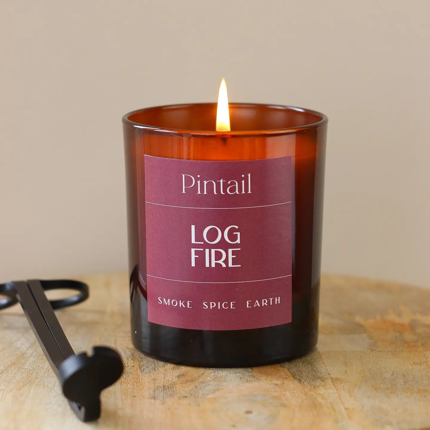 Log Fire Glass Candle with rich smokey incense and cedar wood fragrance, hand poured in Lake District.