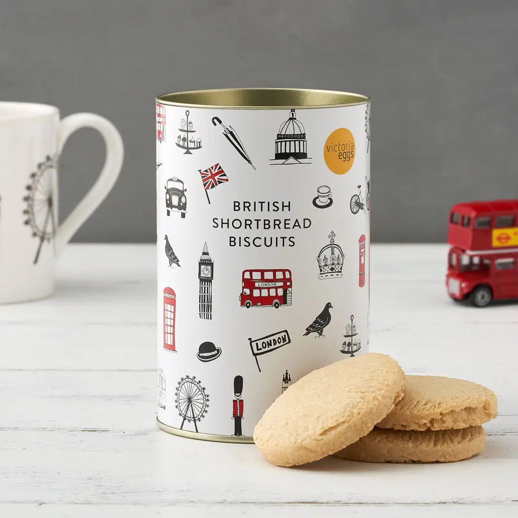 London Shortbread Biscuits in decorative British-themed tin with biscuits and tea cup.