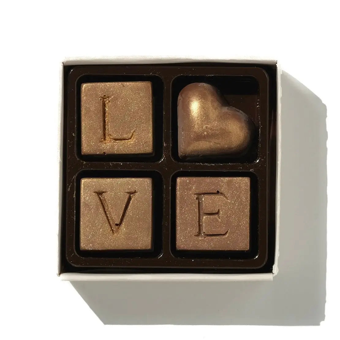 Love Chocolate Box with gold-dusted milk chocolate heart and letter chocolates spelling 'Love'.