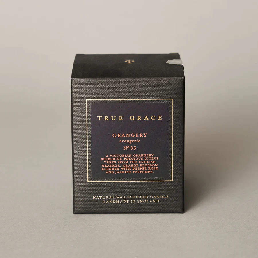 True Grace Orangery classic candle in smoked glass with 40-hour burn time.