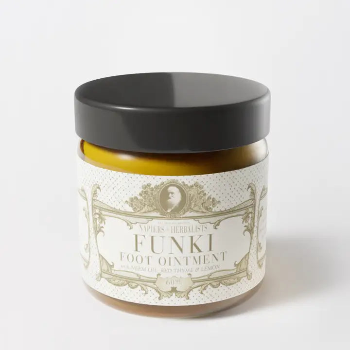 Funki Foot Ointment jar with dark lid, designed for relief from itchy, smelly feet.