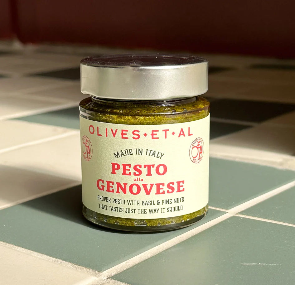 Olives Et Al Proper Pesto Genovese jar on tiled surface.