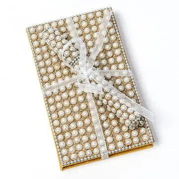 Pearl notebook and pen set with ribbon, compact and elegantly decorated for durability and on-the-go use.