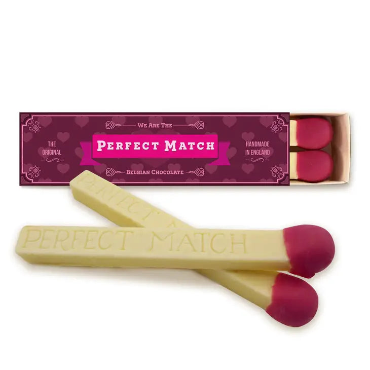Giant white chocolate matches engraved with "Perfect Match" in a decorative box.