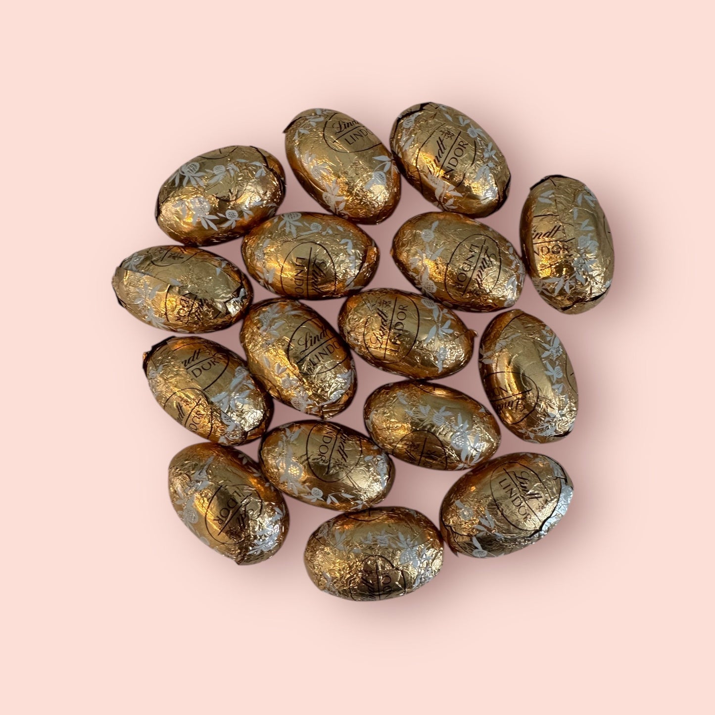 Lindt White Chocolate Mini Easter Eggs with smooth filling in golden foil.