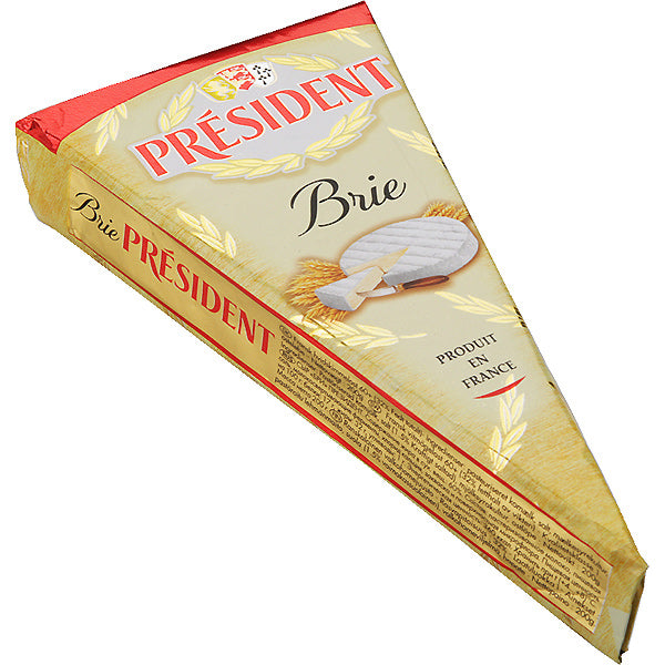 President Brie cheese wedge with creamy texture and rich buttery flavor.