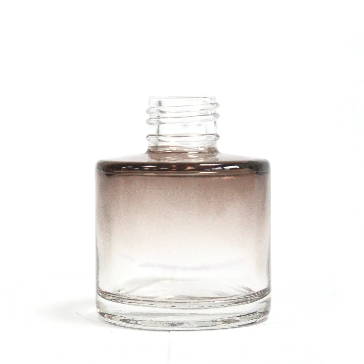 Miniature charcoal round reed diffuser bottle for aromatherapy.