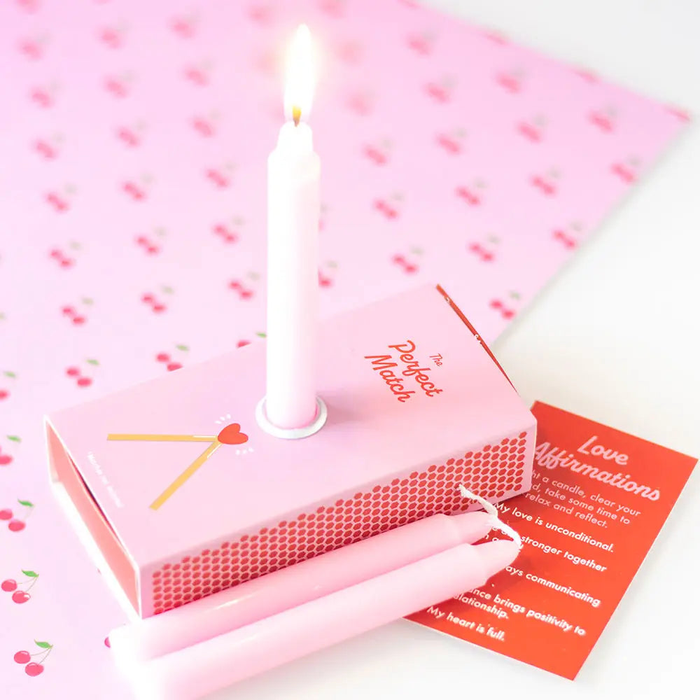 Love affirmation candles in a box with unscented pink candles and mantra card.