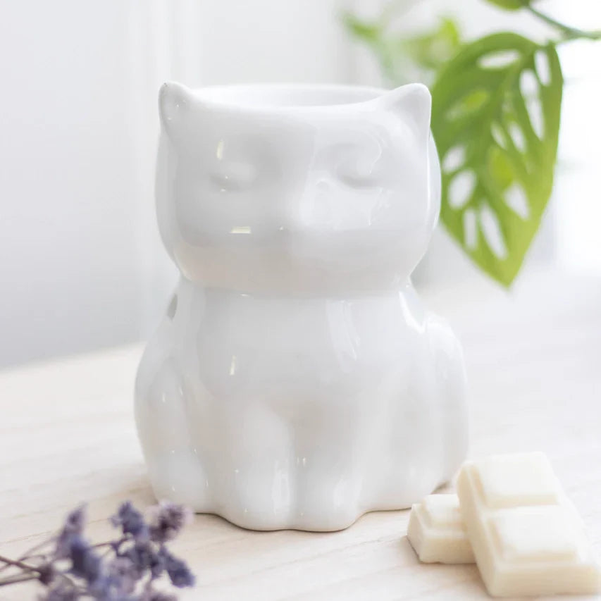 Shiny white cat-shaped oil burner ornament.