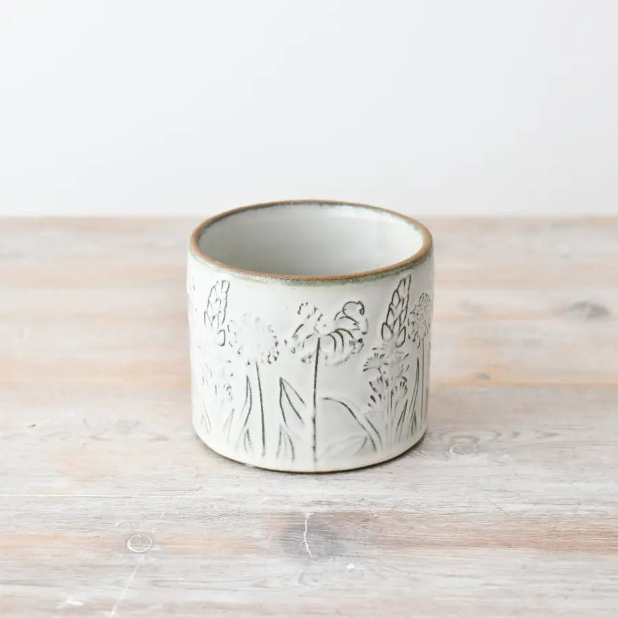 Small flower design plant pot, 11cm, with woodland flower pattern.