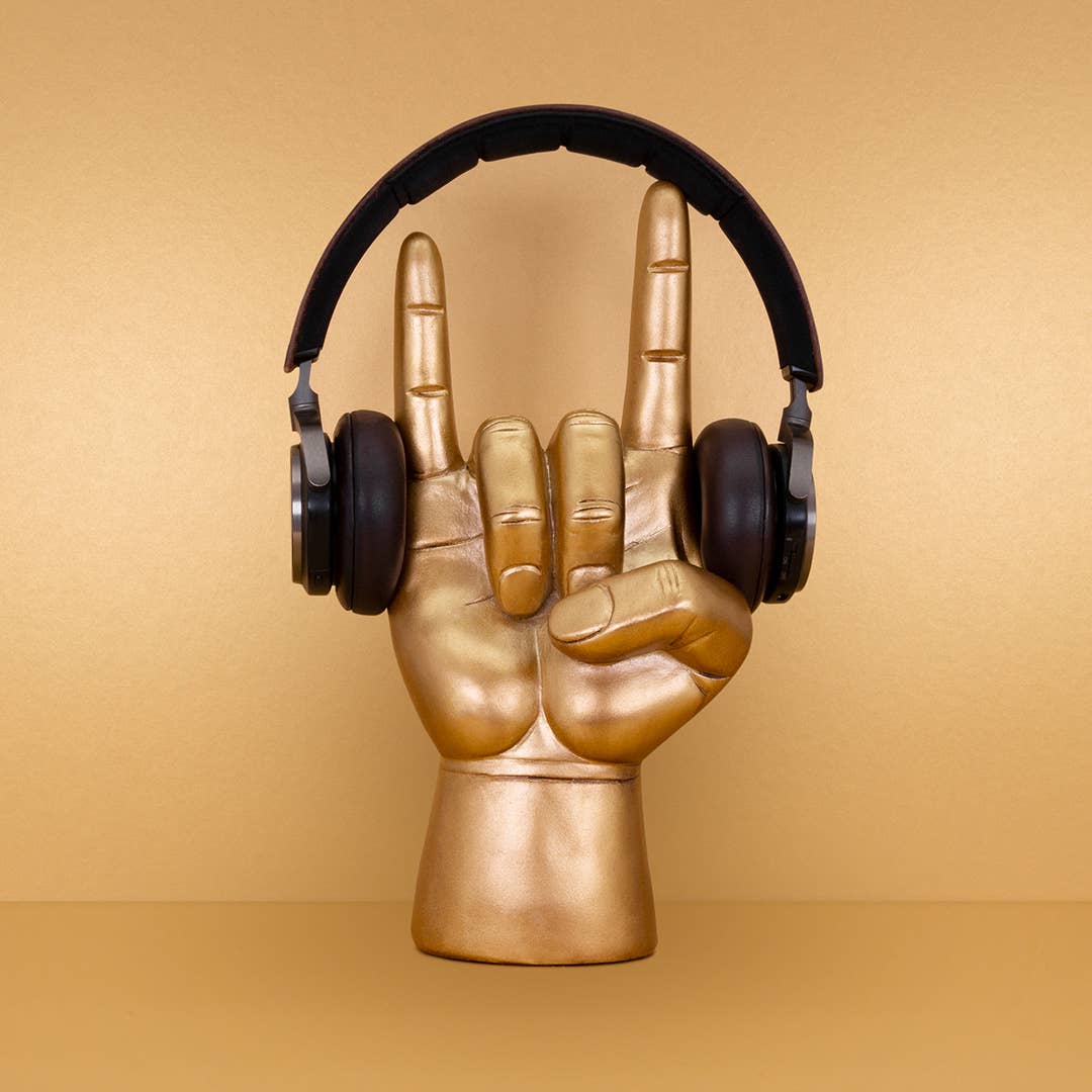 Golden "Rock On" headphone display holder for music lovers.