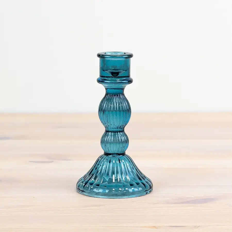 Teal glass pillar candle holder, 15cm, with unique design.