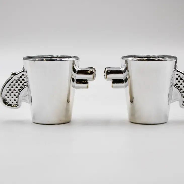 Silver revolver shaped shot glasses set of 2, unique design, gift for gun enthusiasts.