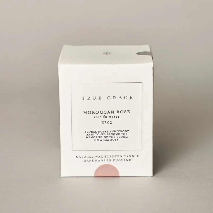 True Grace Moroccan rose classic candle in printed glass packaging, part of the Village Range, made with renewable wax.