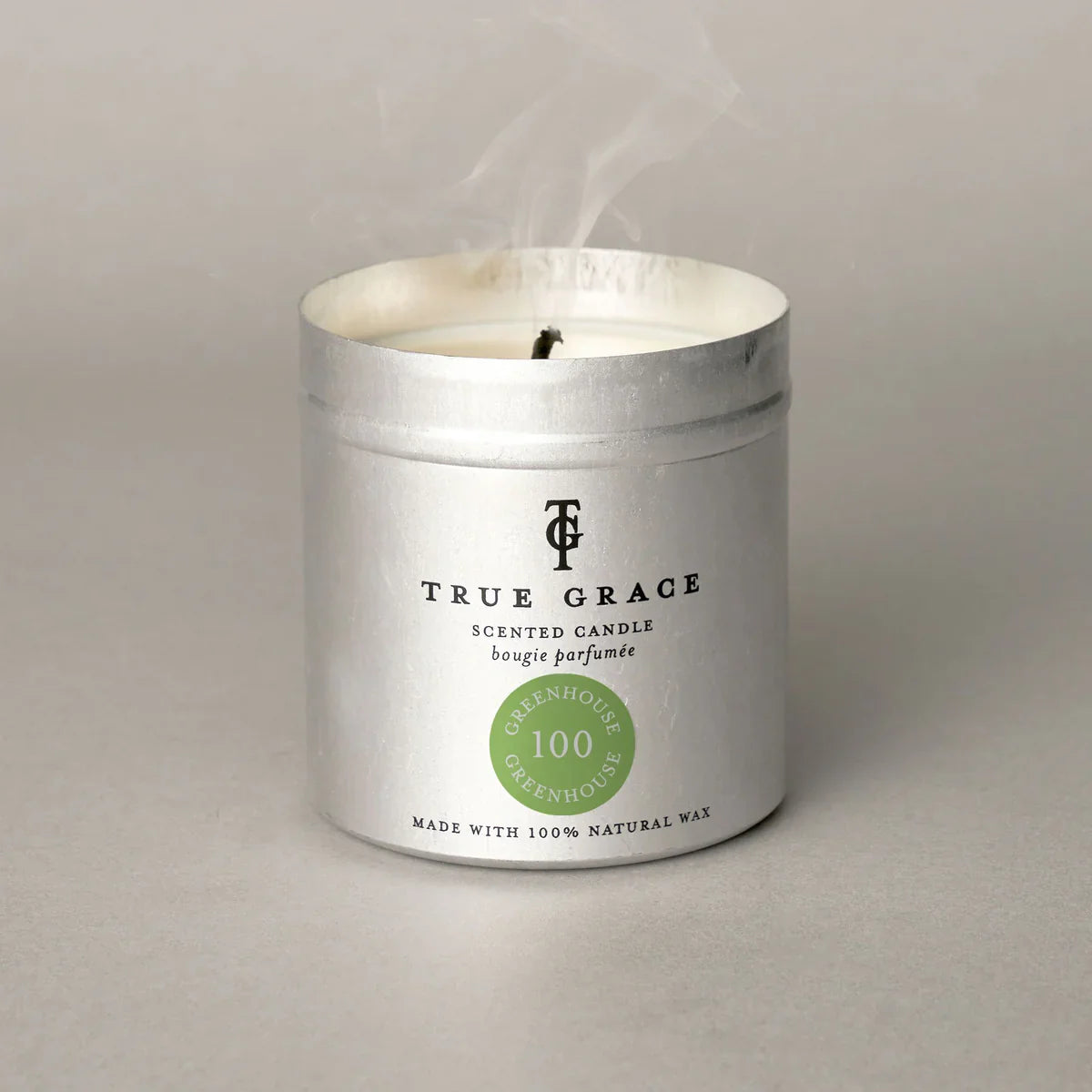 True Grace Greenhouse scented tin candle with silver container.