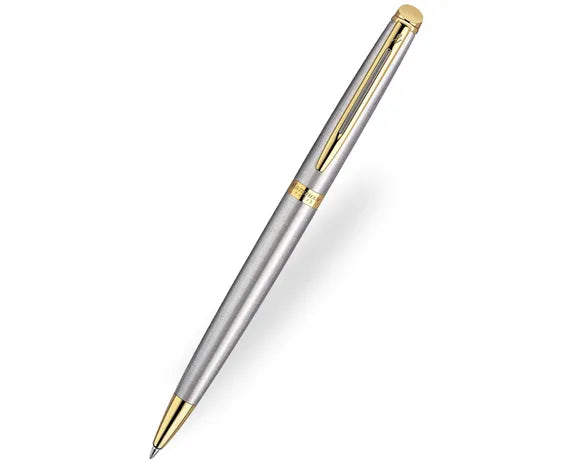 The Waterman Hemisphere ballpoint pen features sleek brushed steel, 23k gold accents, and a slim profile for elegant, comfortable writing.