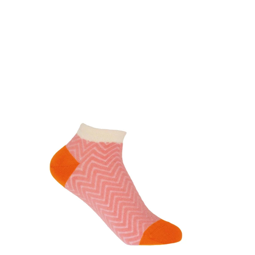 Bright and colourful women's pink trainer socks with zigzag pattern and orange accents.