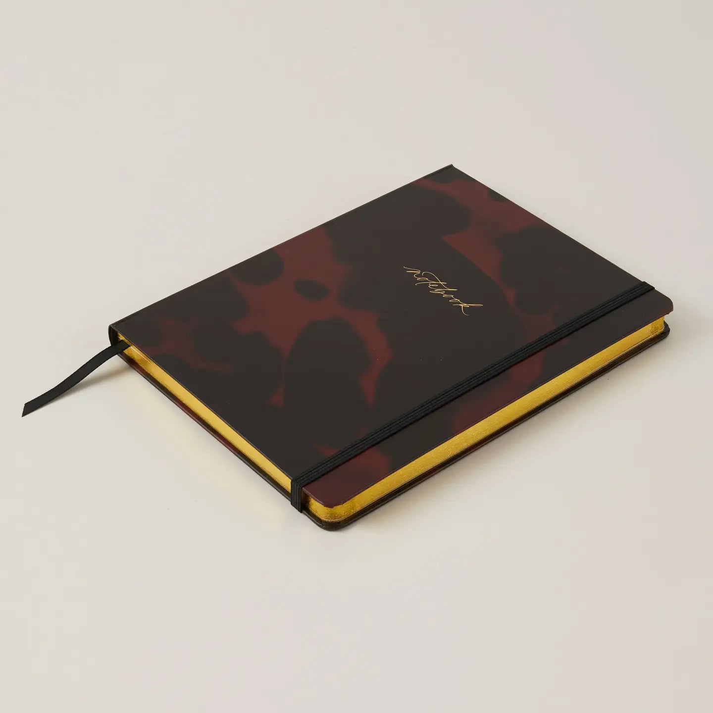 Luxury Notebook in Tortoise design, compact and stylish for modern gentlemen.