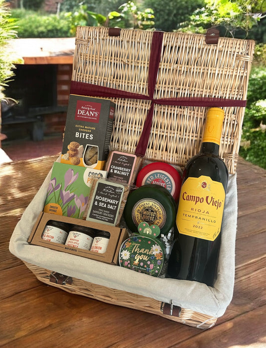 Wine and Cheese hamper with premium red wine, cheddar cheese, chocolate, thank you soap and more. Perfect for a classy appreciation gift.