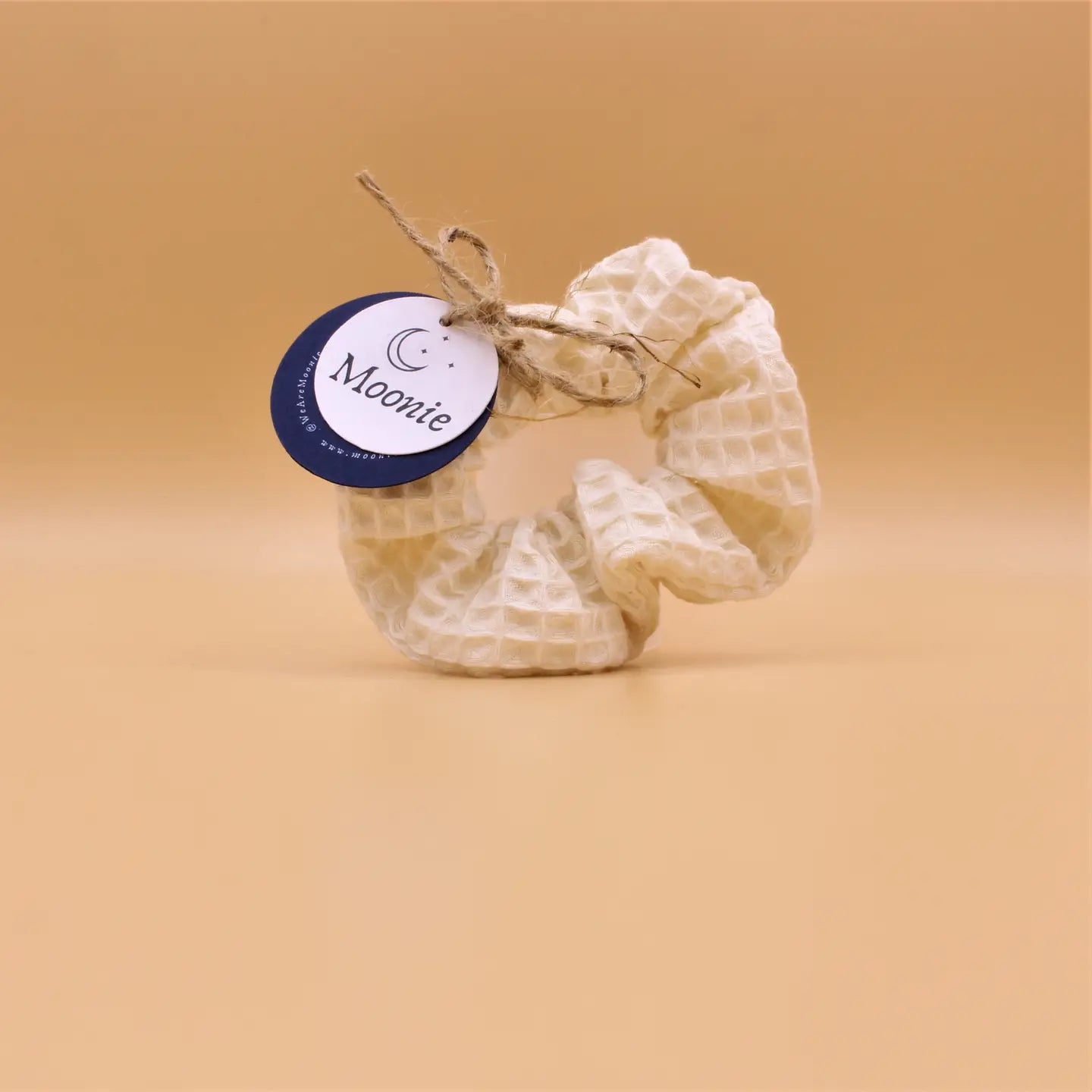 Cream cotton hair scrunchie, eco-friendly, stylish, sustainable materials, soft cream color, versatile hair accessory.