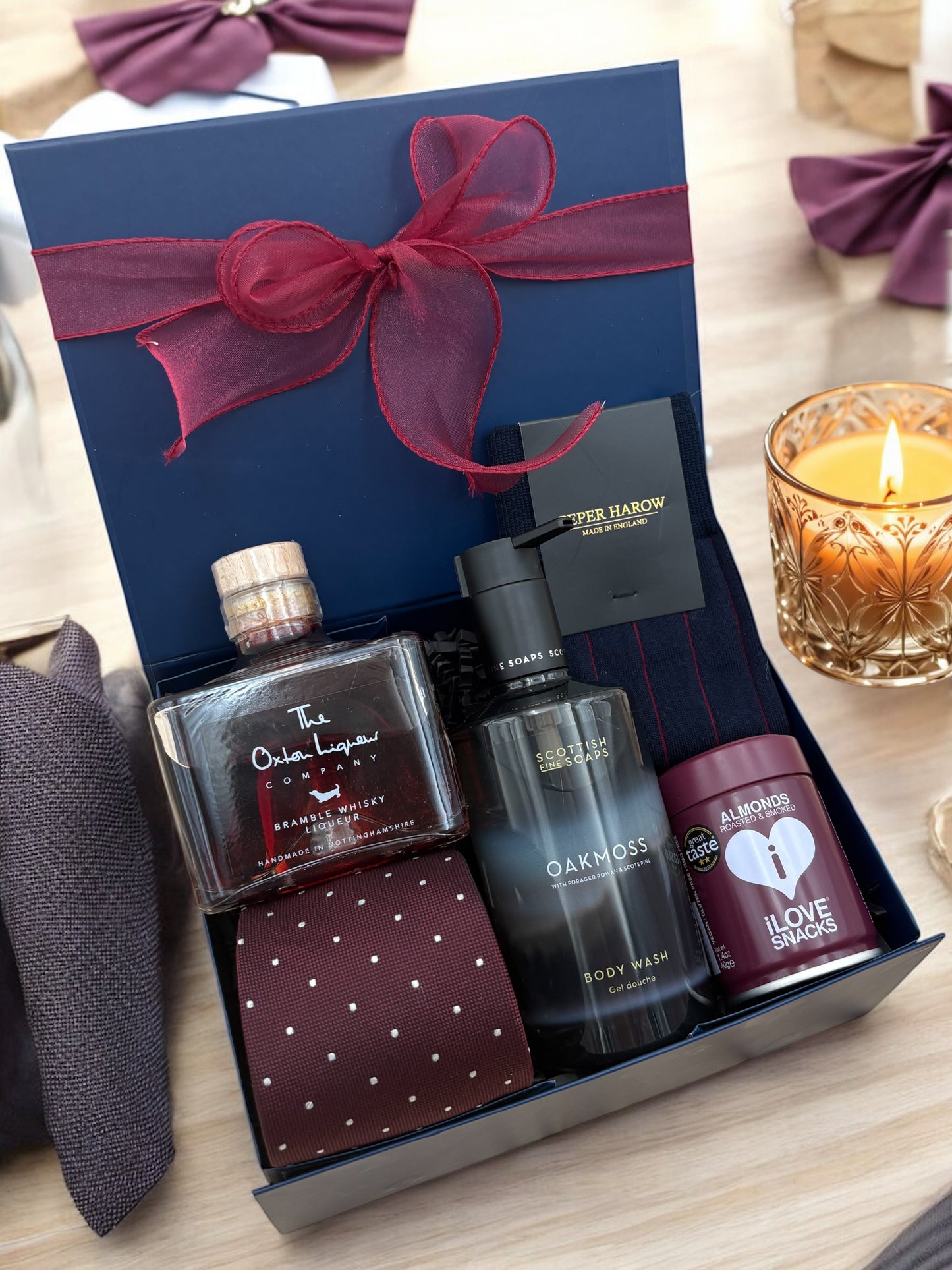 Luxury dad gift box with cheese, tie, liqueur, and snacks.