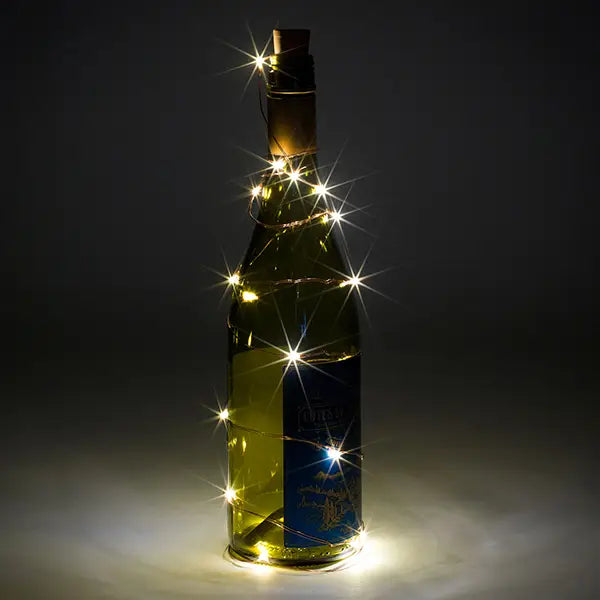 Decorative bottle lights with cool white LED on wine bottle.