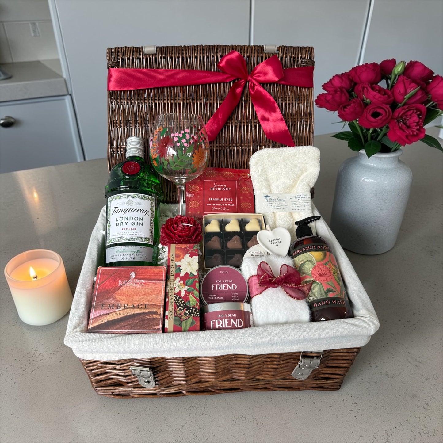 Special friend gift hamper with wildflower glass, bath salts, candle, fluffy socks, chocolates and choice of gin, wine or cava.