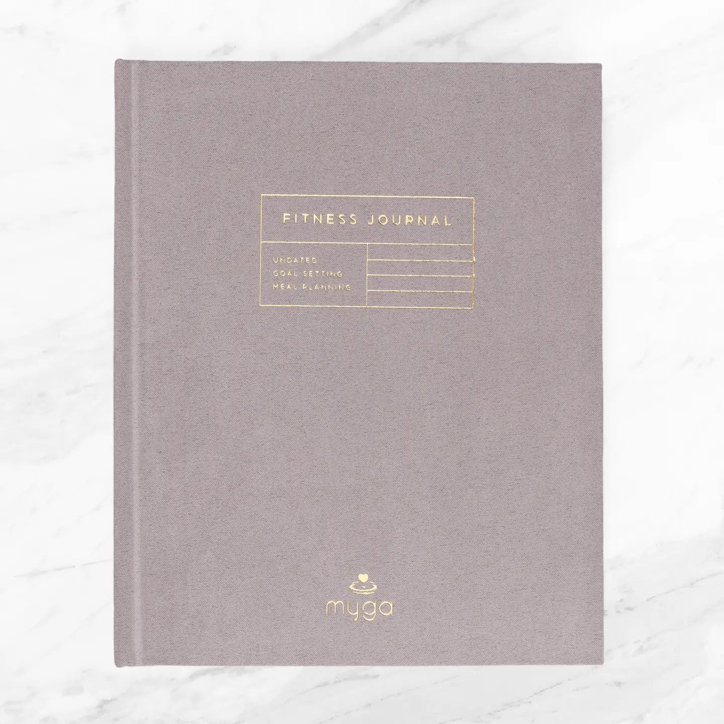 Suede hardcover fitness journal for tracking progress and goals.