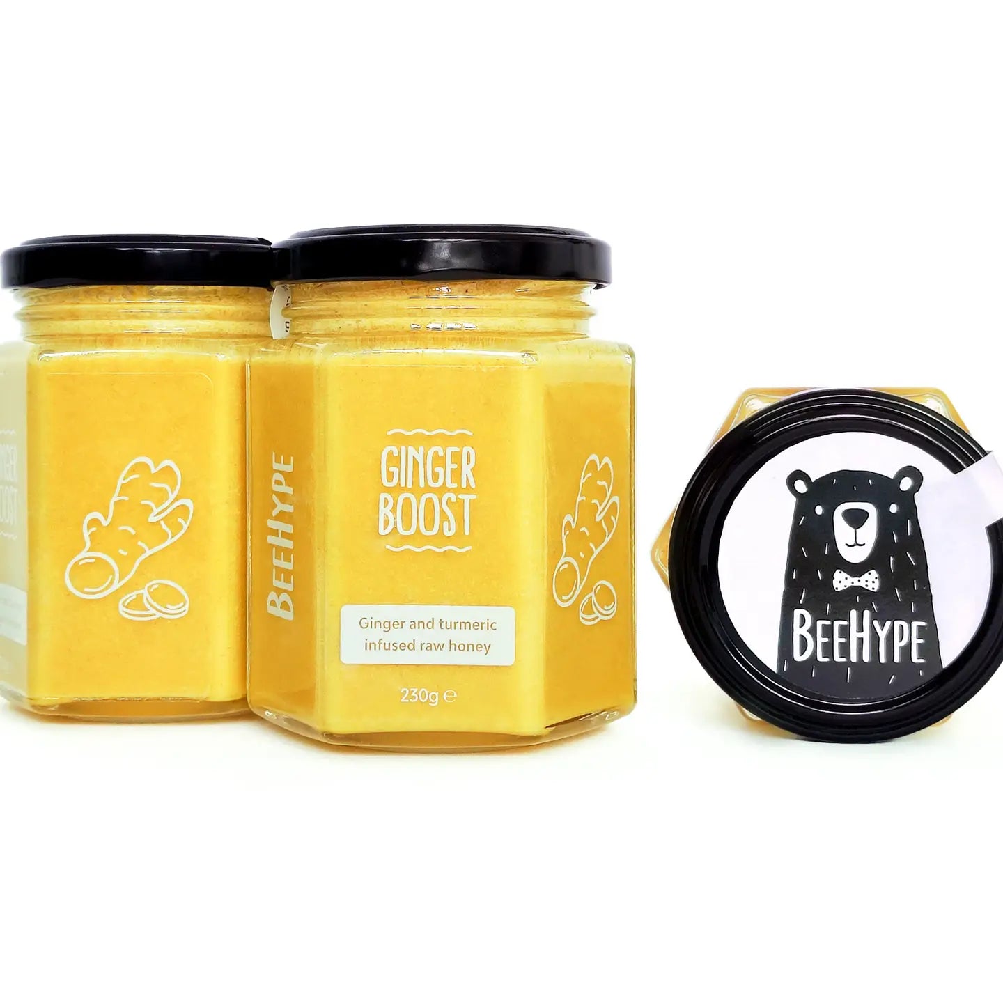 Ginger Boost Honey jar with ginger and turmeric infusion for energy and immune support.