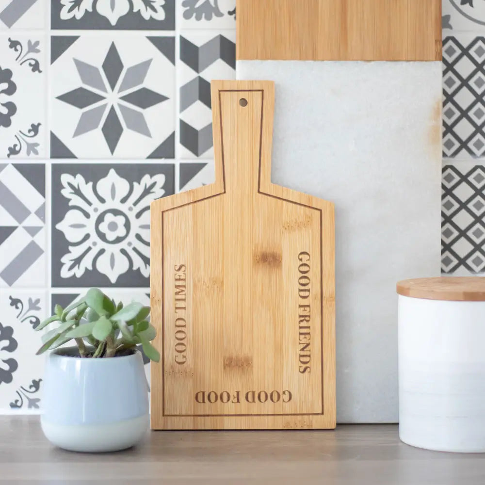Bamboo serving board with "Good Times" engraving, perfect for kitchen or dining.