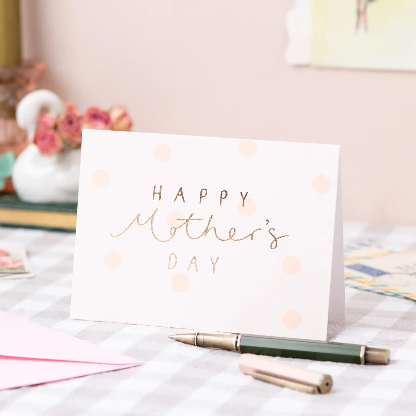 Happy Mother's Day card with gold foil text and peach polka dots.