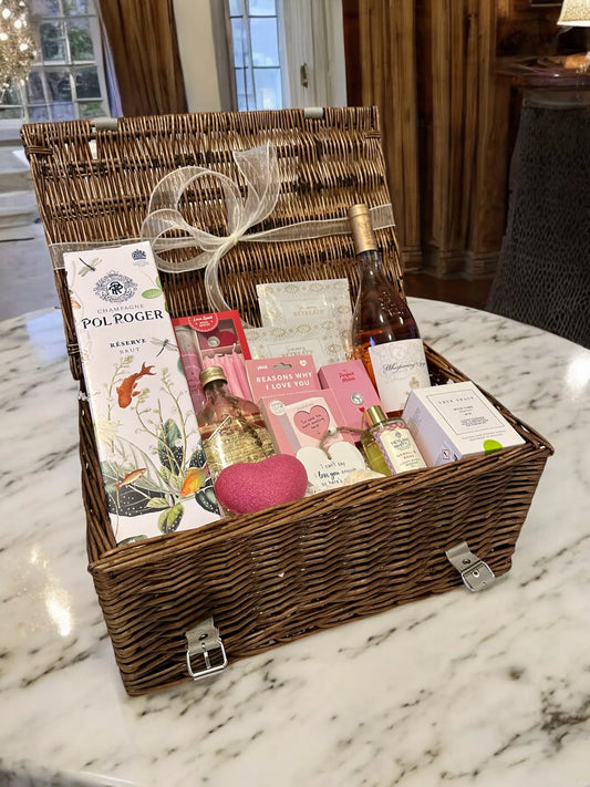 Sparkling Romance gift hamper featuring Pol Roger Champagne, Whispering Angel Rosé, aromatherapy oils, True Grace candle, Konjac sponge, and luxury bath items.