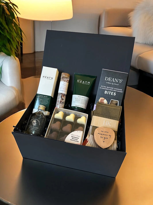 No One Measures Up Hamper featuring men's designer socks, grooming products, aromatherapy oils, gourmet treats, and a personalized tape measure.