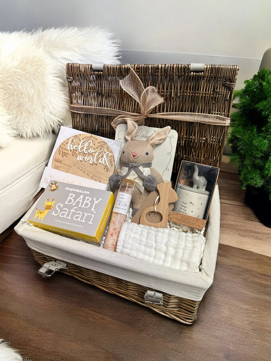 Baby Safari Keepsake Hamper with giraffe teether, bunny rattle, safari socks, announcement plaque, elephant money box, and bath salts.