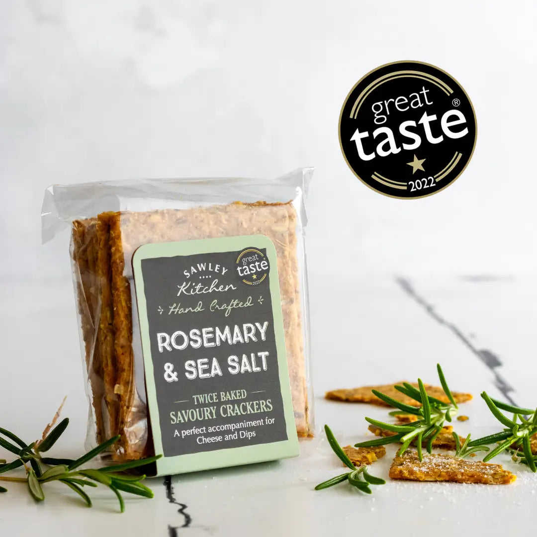 Rosemary & Sea Salt Yorkshire Savoury Crackers in packaging with herbs and Great Taste award.