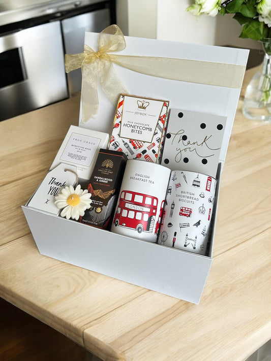 Thank You Treats Hamper with luxury candle, English breakfast tea, shortbread, hand cream, honeycomb bites, daisy candle, plaque, and gift card.